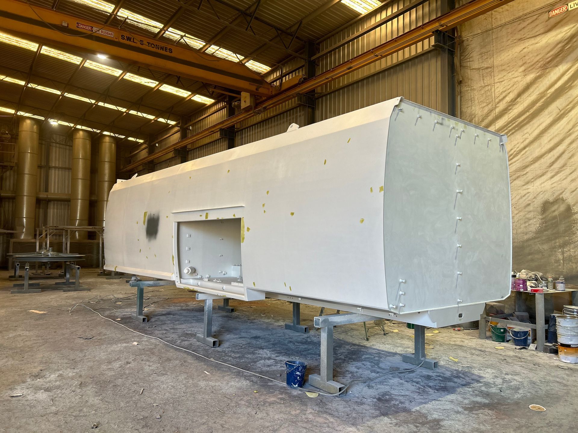 a worker colouring machinery with spray paint machine