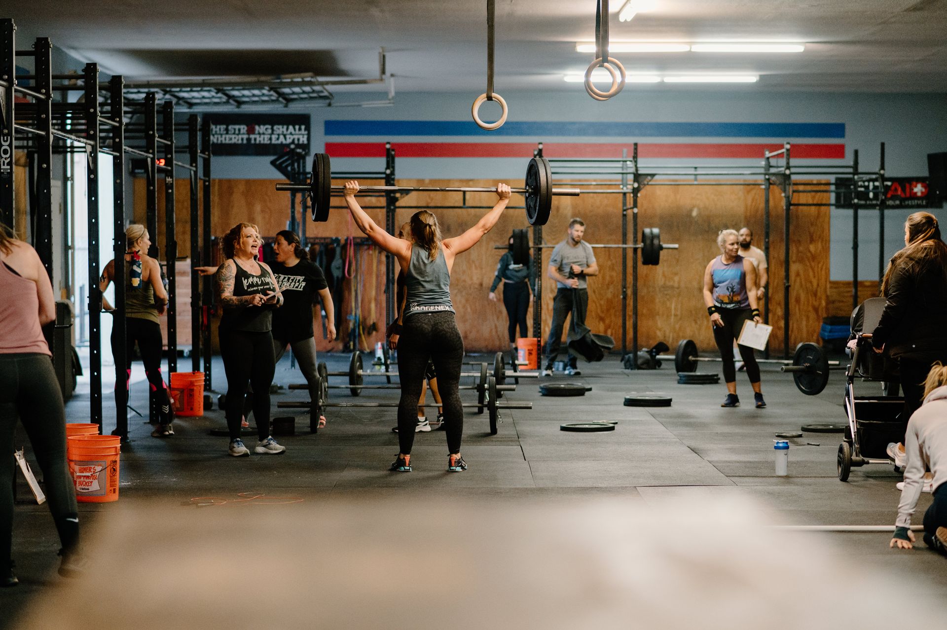 A group of people are doing exercises in a gym.