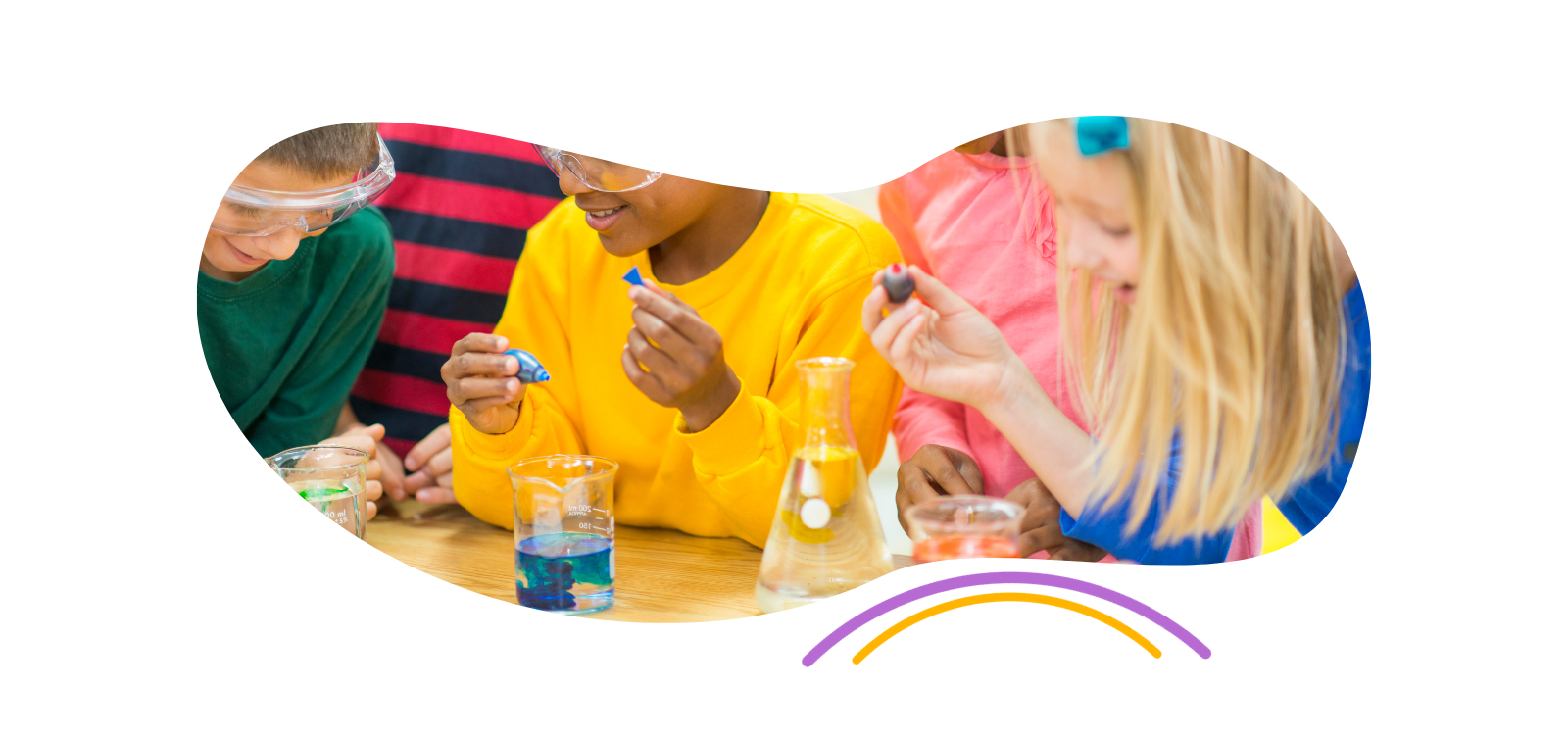 a group of children are sitting at a table doing a science experiment .