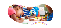 a group of children are sitting at a table drawing with crayons .
