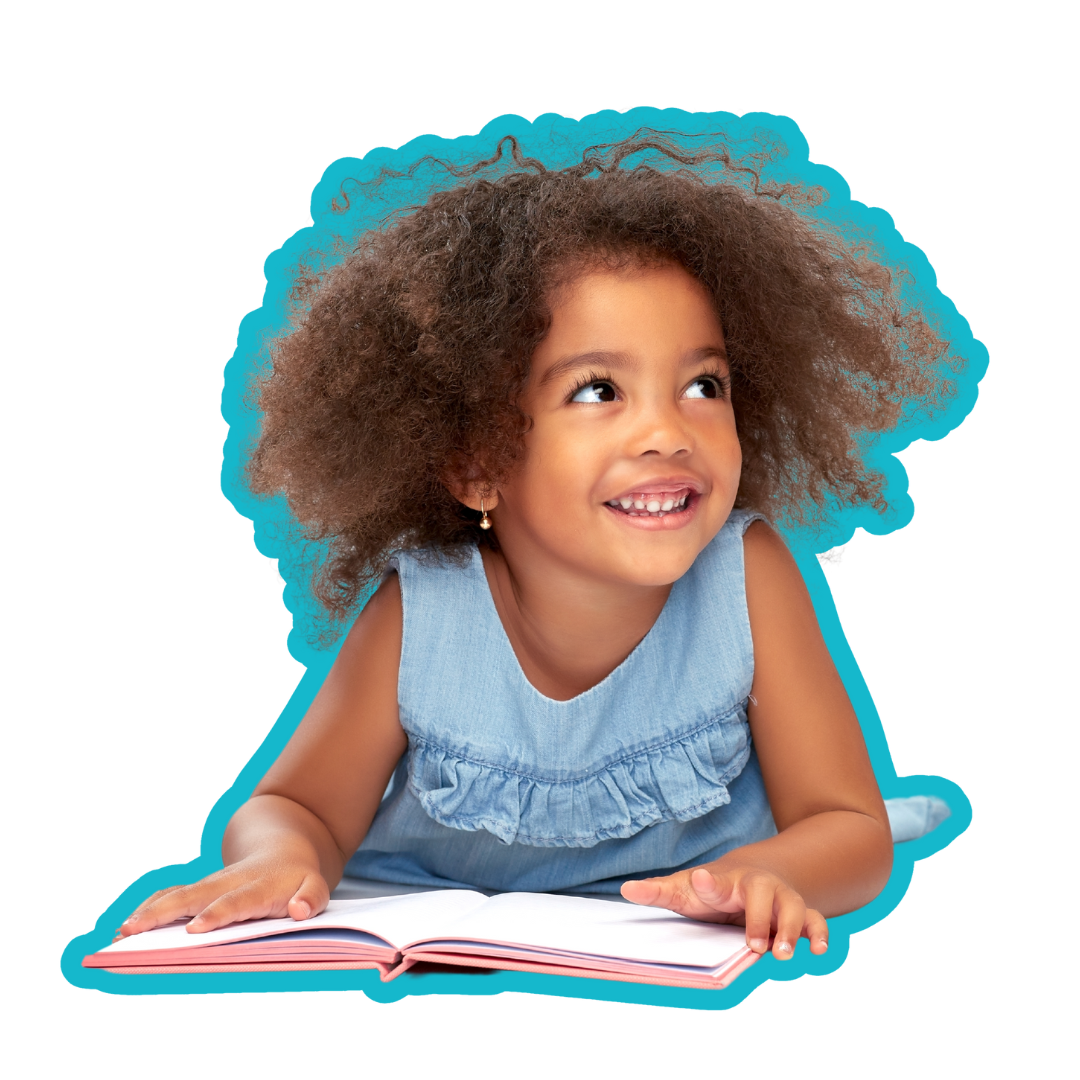 a little girl is laying on the floor reading a book