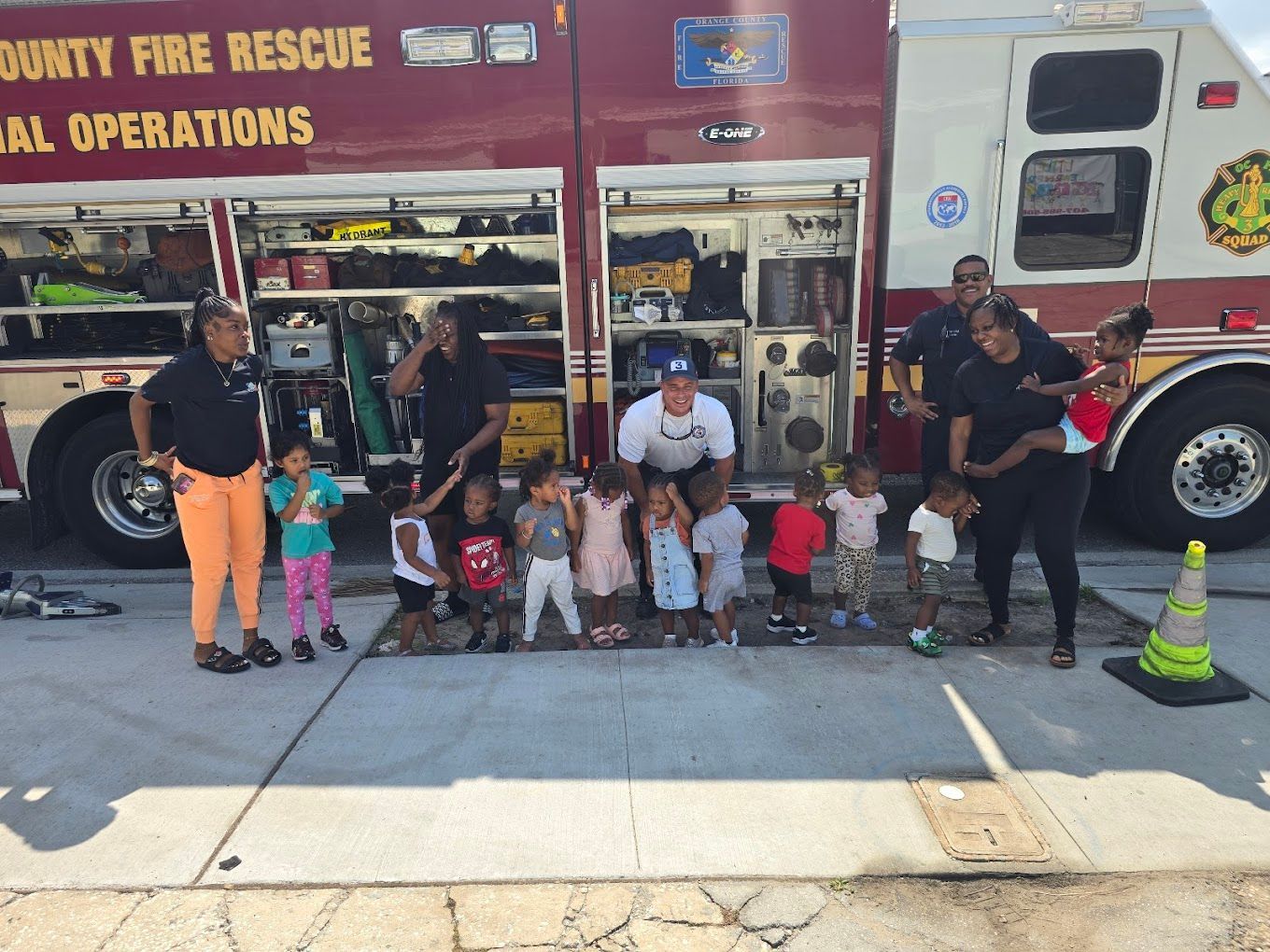 A boy wearing a shirt that says game on it