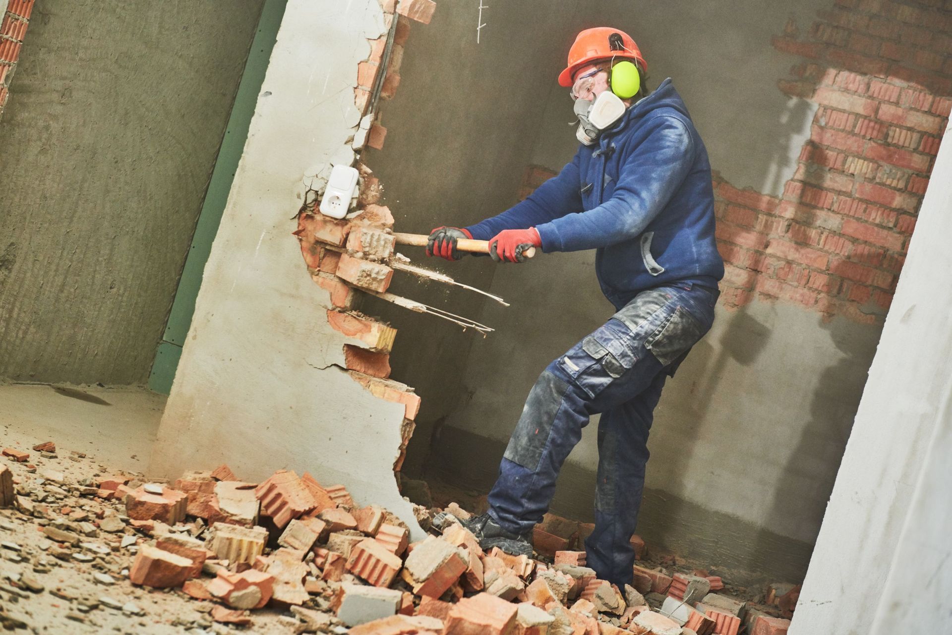 demolition work rearrangement worker sledgehammer destroying