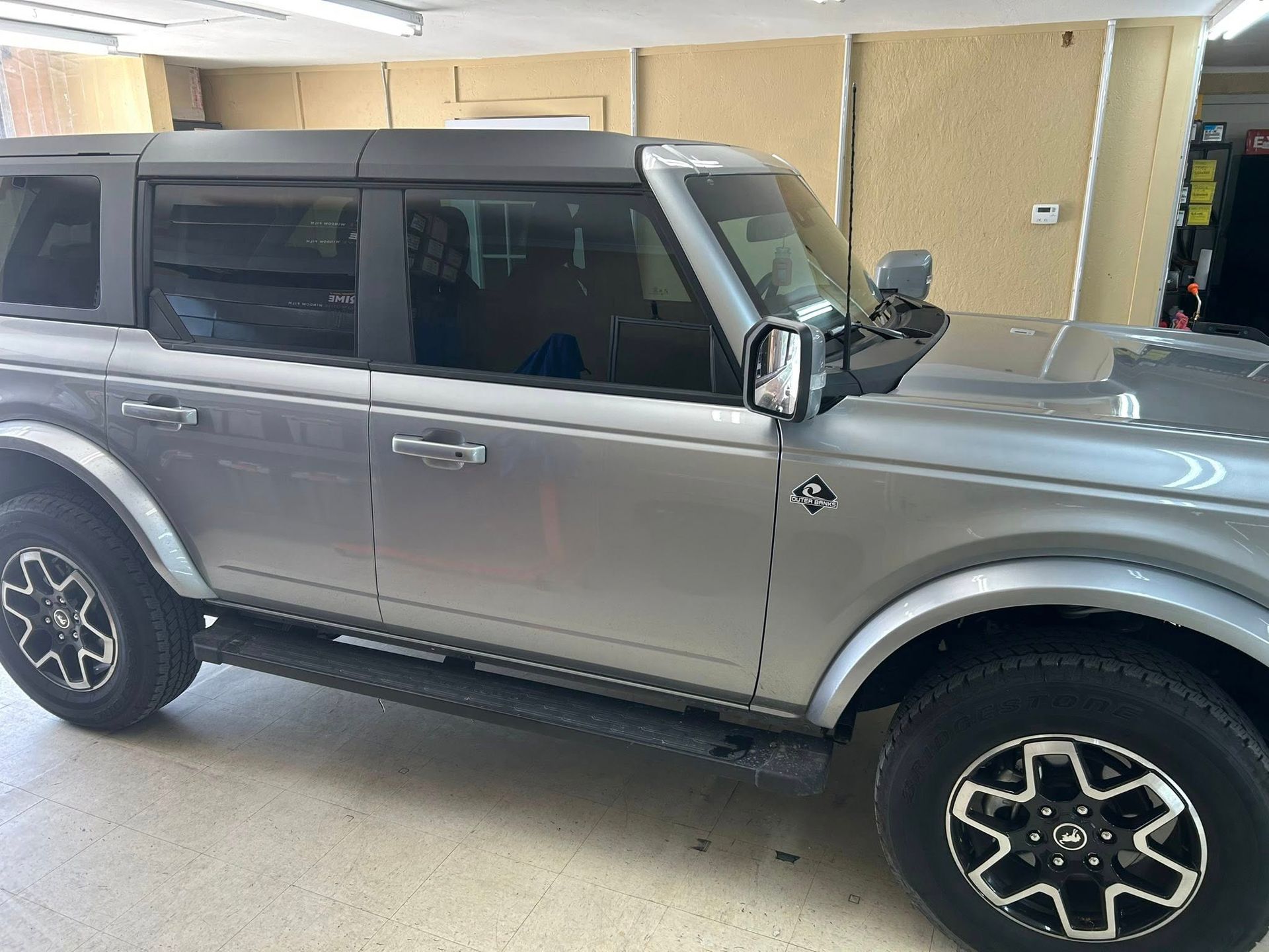 Black Mercedes SUV in a garage.