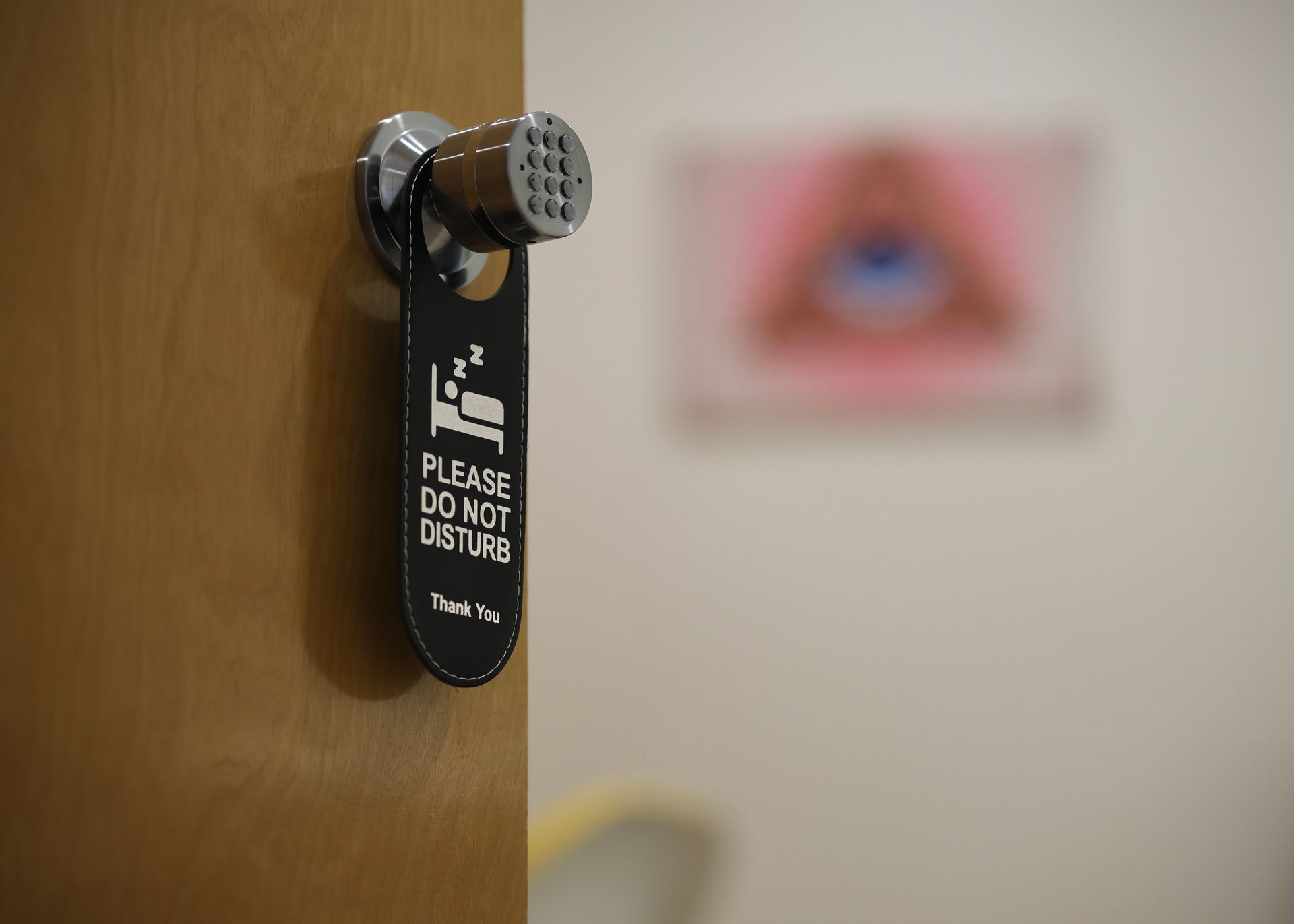 A door with a do not disturb sign on it