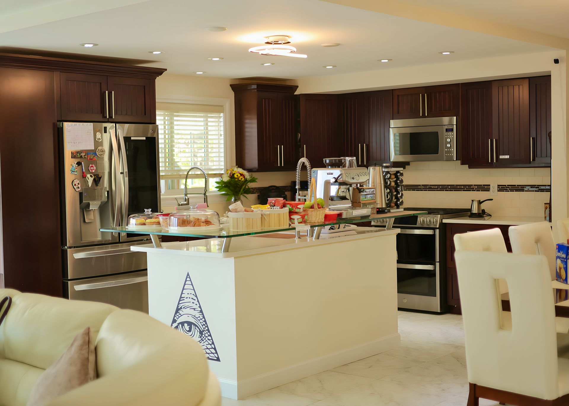 A kitchen with stainless steel appliances and wooden cabinets
