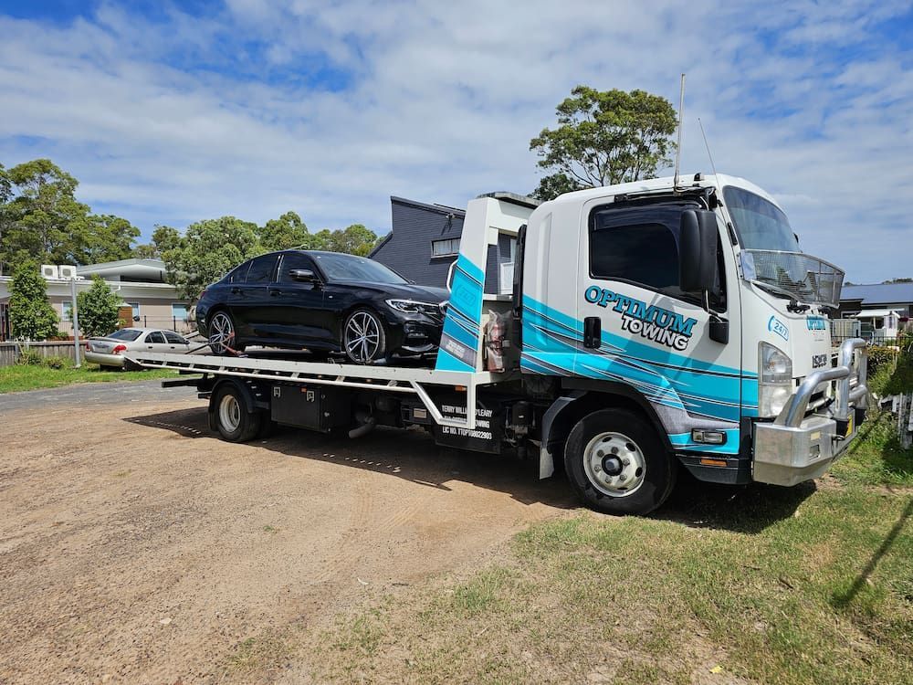 Broken Red Car And Tow Truck — Optimum Towing in Gerringong, NSW