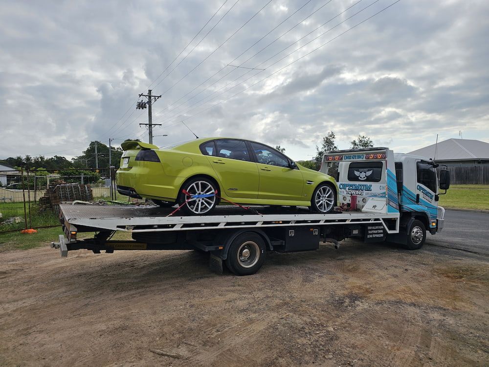 Lime Green Car on a Flatbed Tow Truck. — Optimum Towing in Bomaderry, NSW