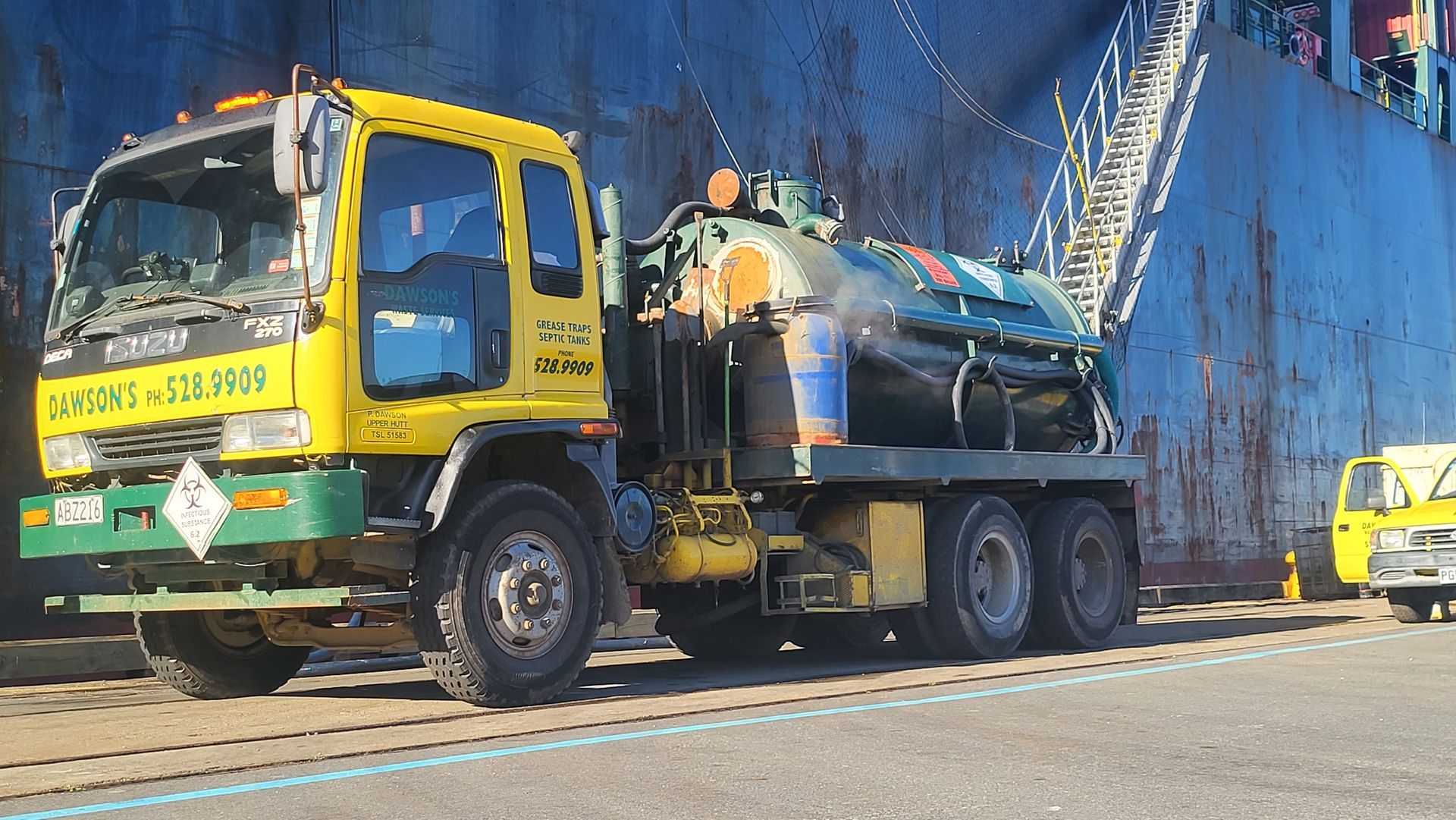 A yellow and green truck.