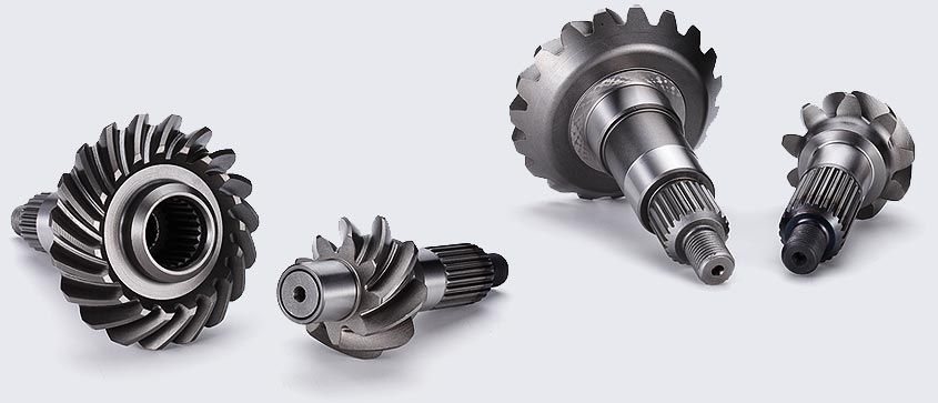 A group of gears and shafts on a white surface