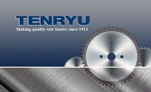 A circular saw blade is sitting on top of a piece of metal.