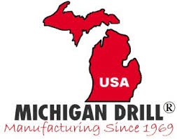 A logo for michigan drill manufacturing since 1969.
