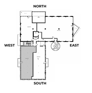 Floor plan of a building with rooms and labeled directions: North, South, East, and West. Shaded area in the south.