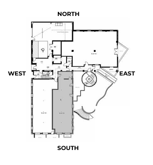 Floor plan of a building, with labeled directions (North, South, East, West). Rooms are shown with windows and doors.
