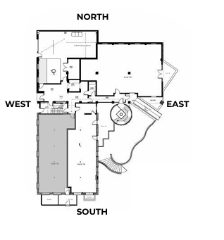 Floor plan of a building, oriented with compass directions. Features rooms and outdoor areas.