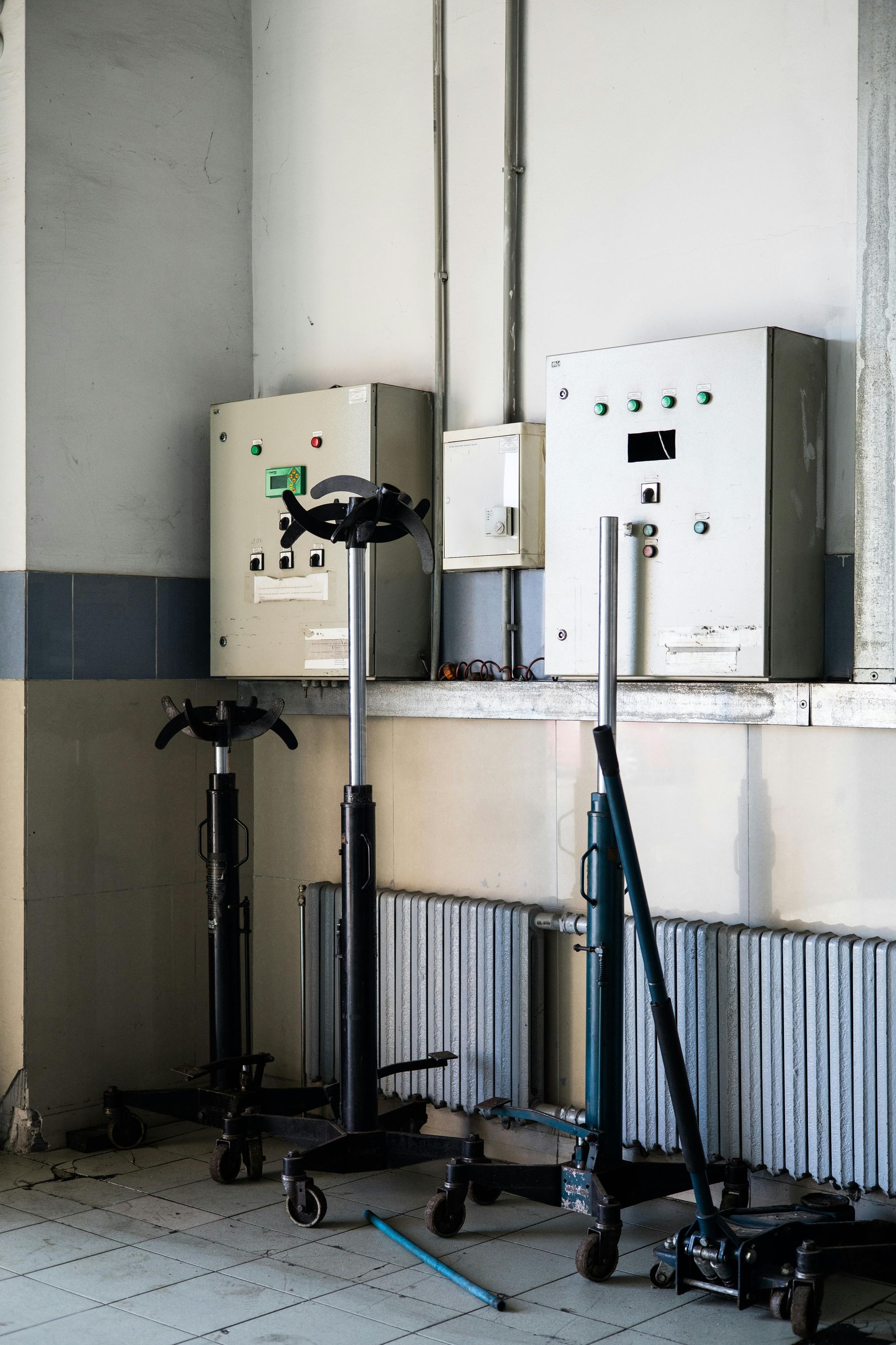 A person is pressing a button on an electrical panel.