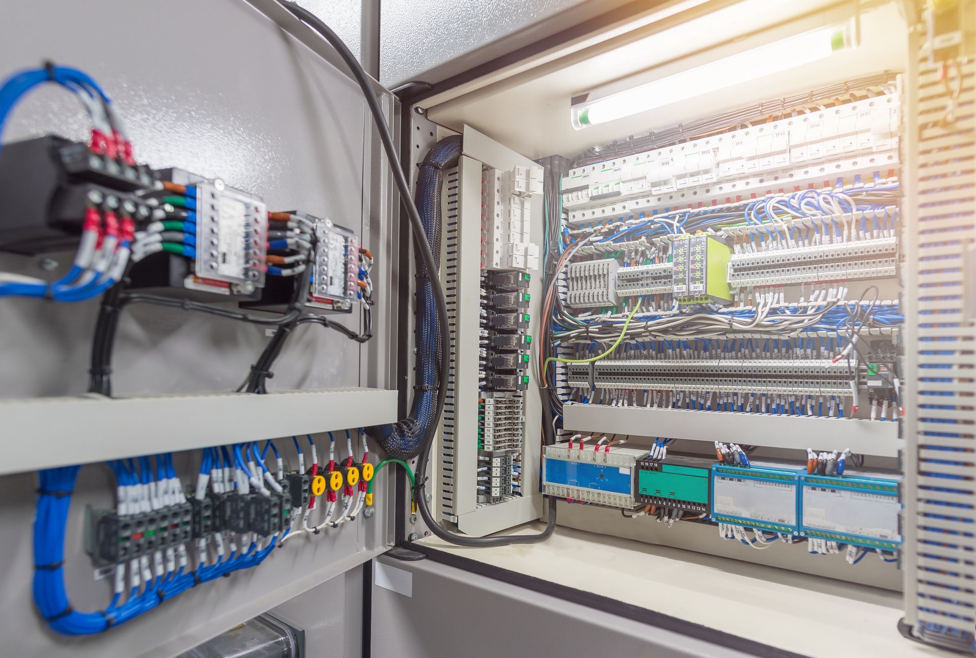 A very large electrical box with a lot of wires coming out of it.