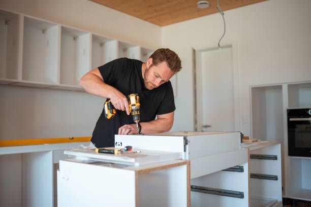 Carpenter assembling custom built-in shelving unit