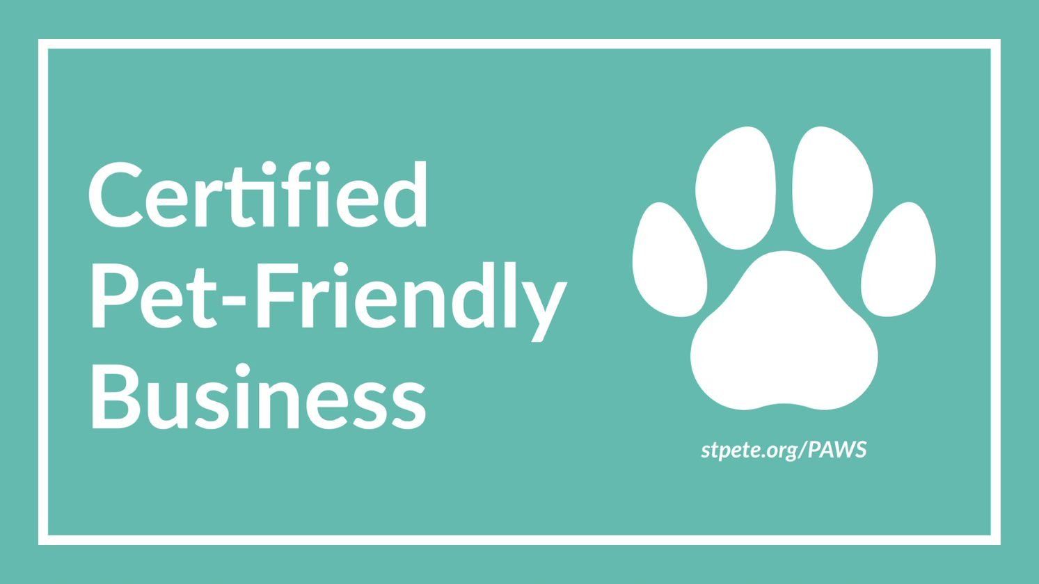 A certified pet-friendly business logo with a paw print on a blue background.