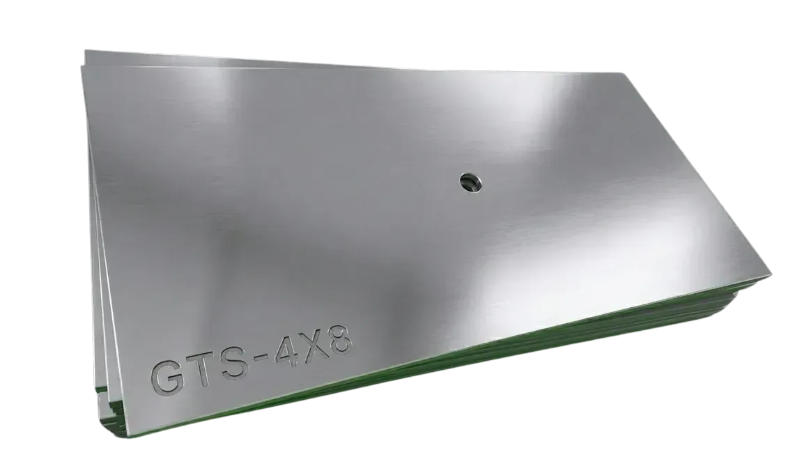 A rectangular metal panel with a shiny, reflective surface, stamped with the text