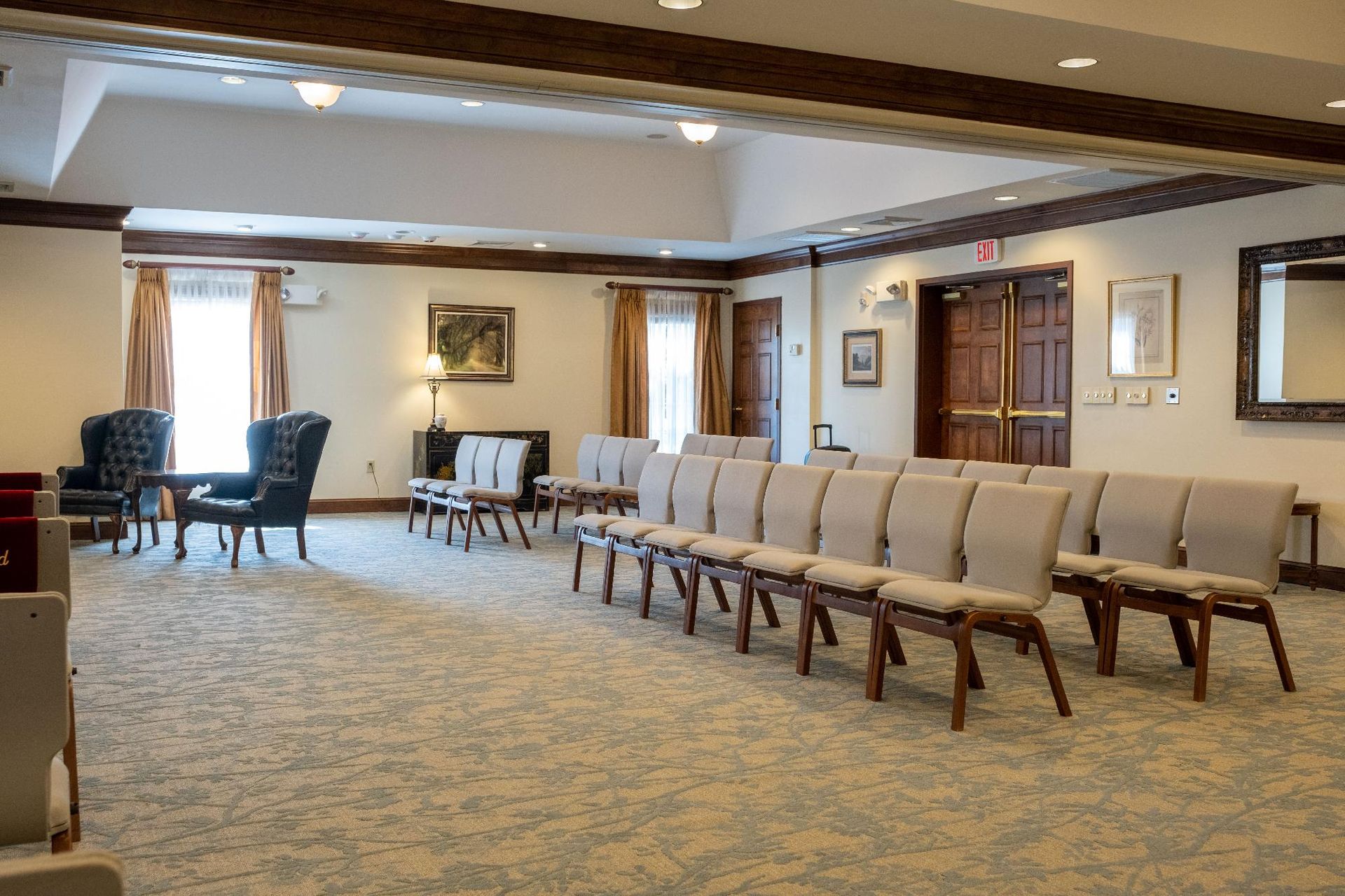 A large room with a lot of chairs and tables in it.