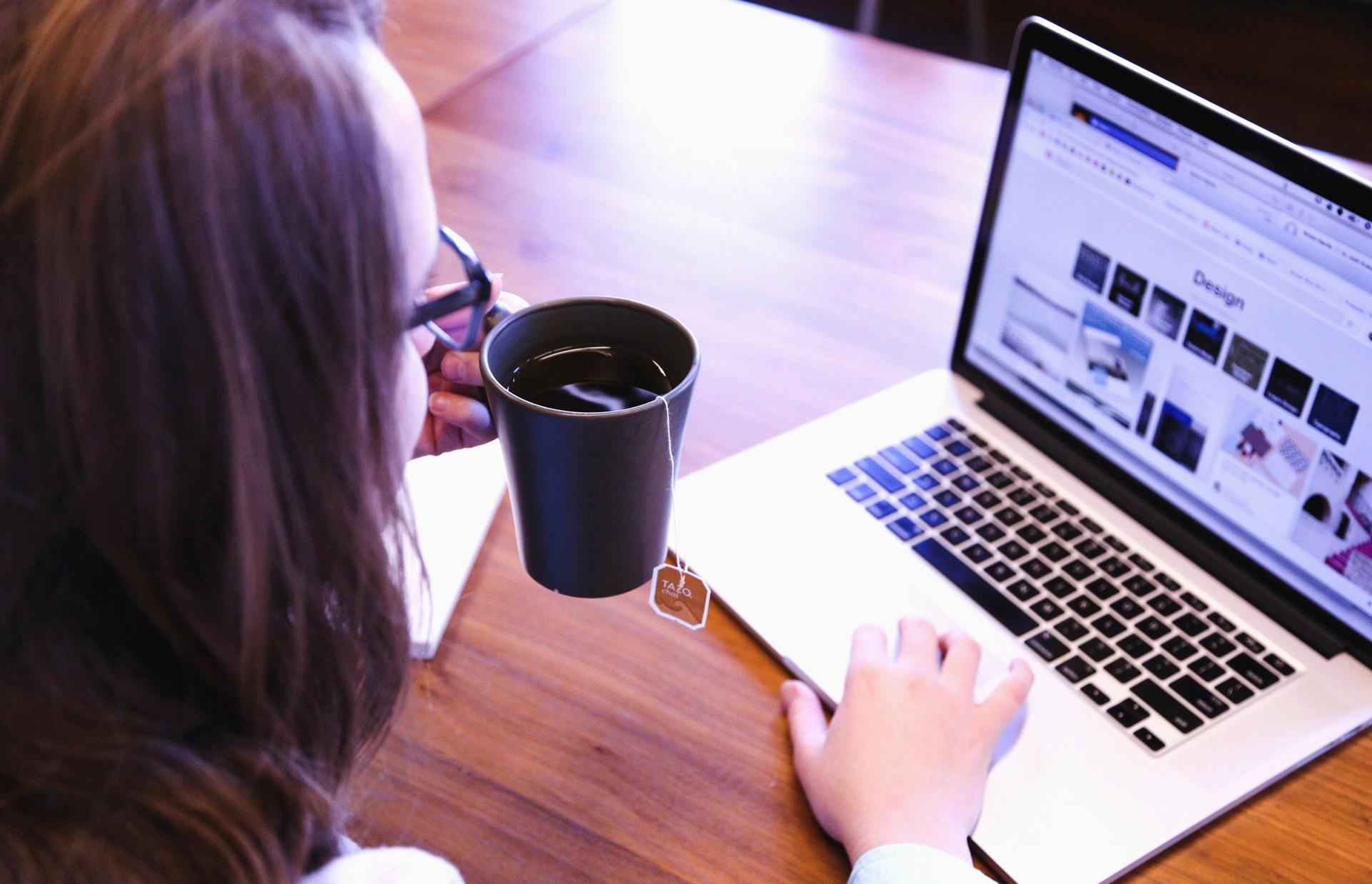 WSI Digital Marketing in Colorado woman using laptop social media and drinking coffee