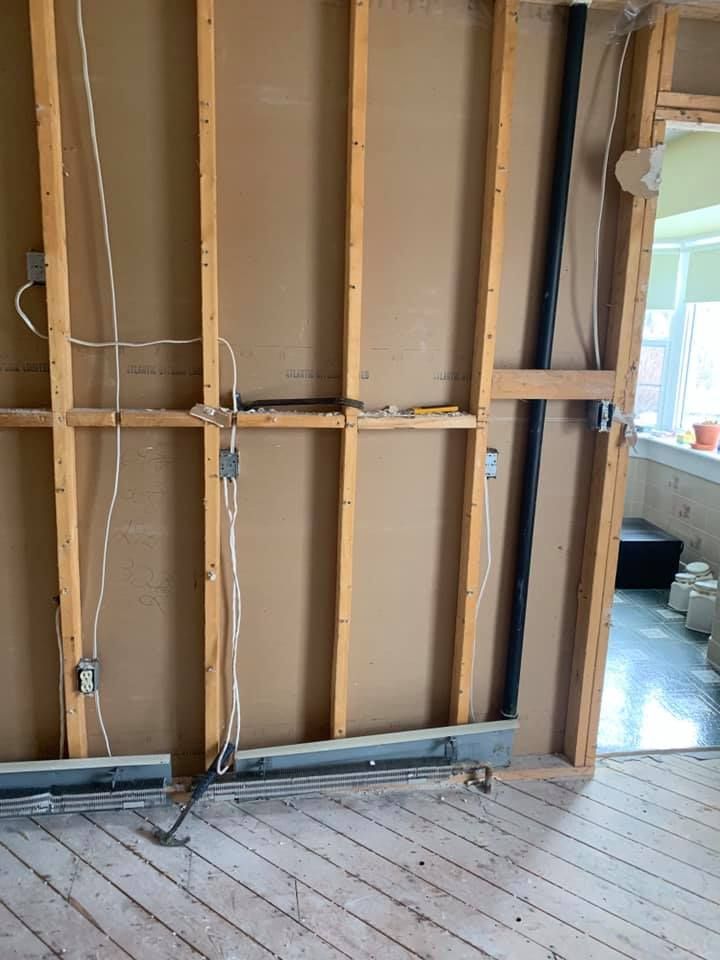 A room with a wooden wall and a wooden floor.