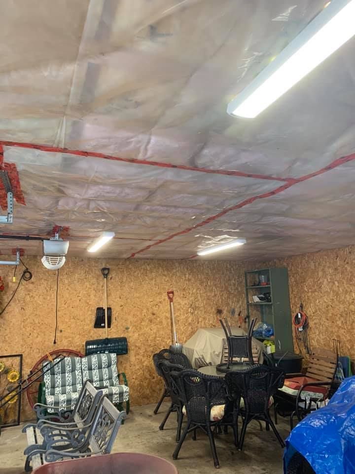 A garage with a table and chairs in it.