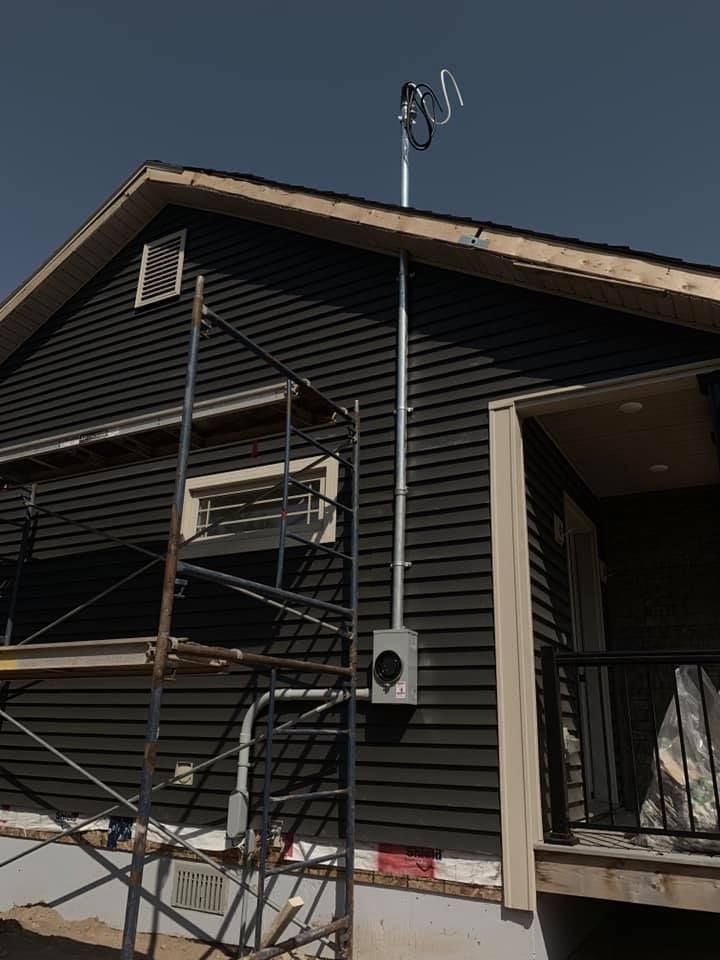 A house under construction with a scaffolding around it