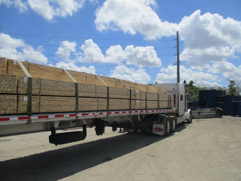 Trailer Truck With Wooden Planks — Miami, FL — J & M Scaffolds of Florida