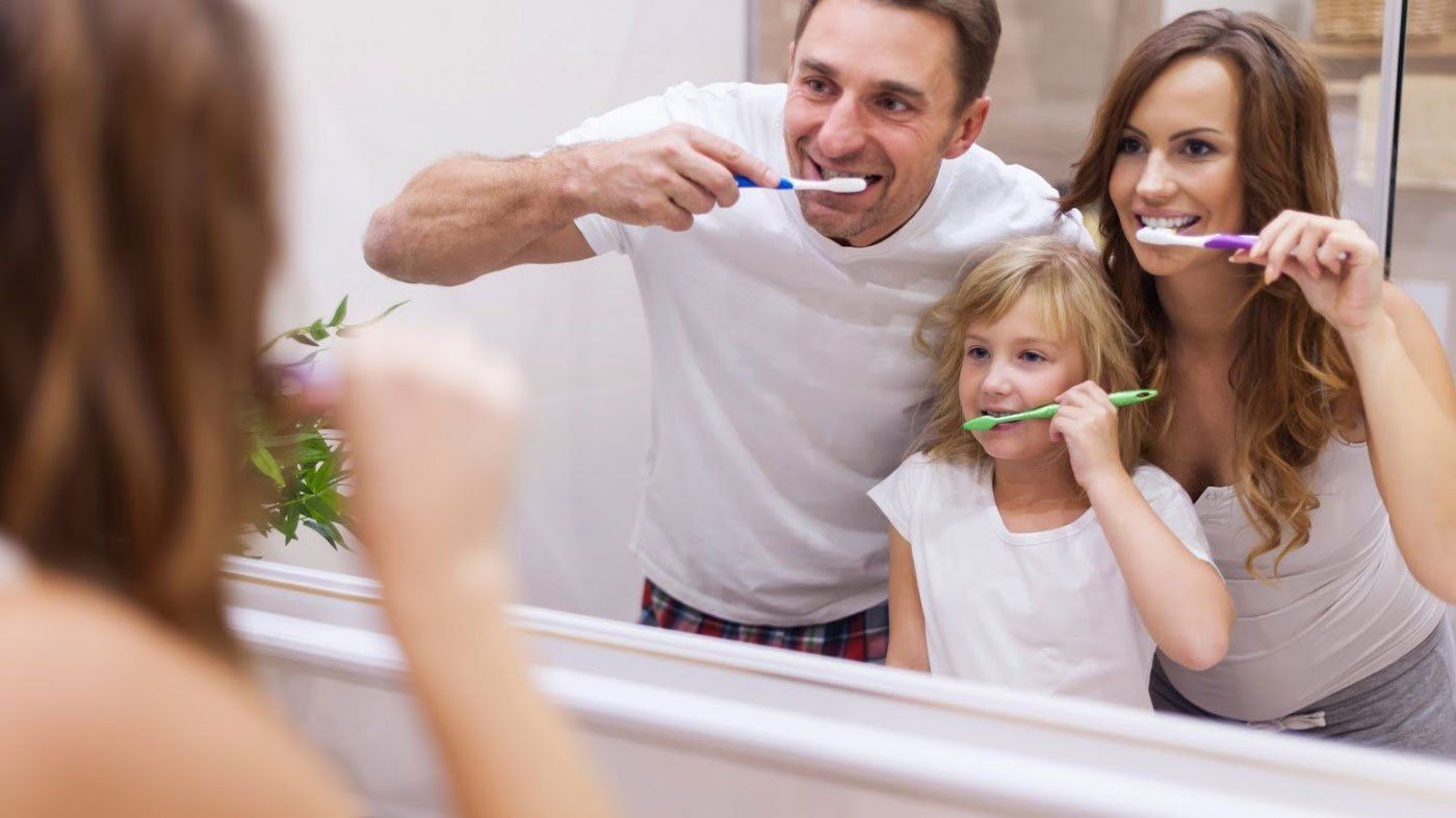 Family Brushing Their Teeth Together — Portage, IN — Airport Road Dental Associates, PC