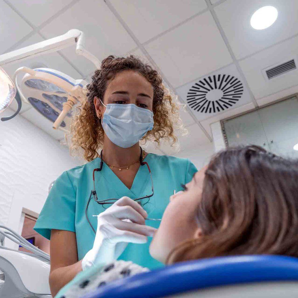A Dentist Doing a Tooth Extraction — Portage, IN — Airport Road Dental Associates, PC