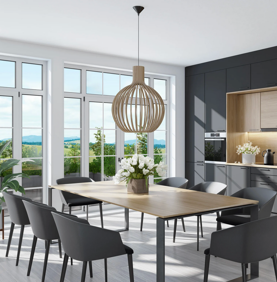 A dining room with a wooden table and chairs