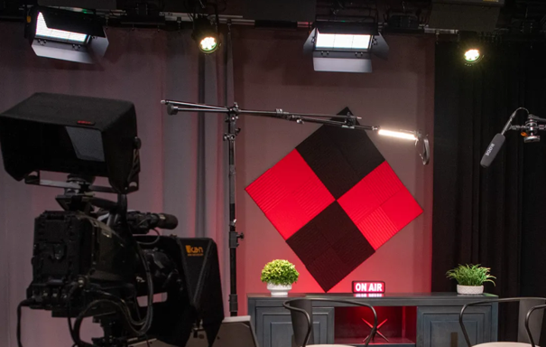 A studio with a camera and a sign that says onair