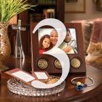 Wooden table with a large number 3, photos, and decorative items.