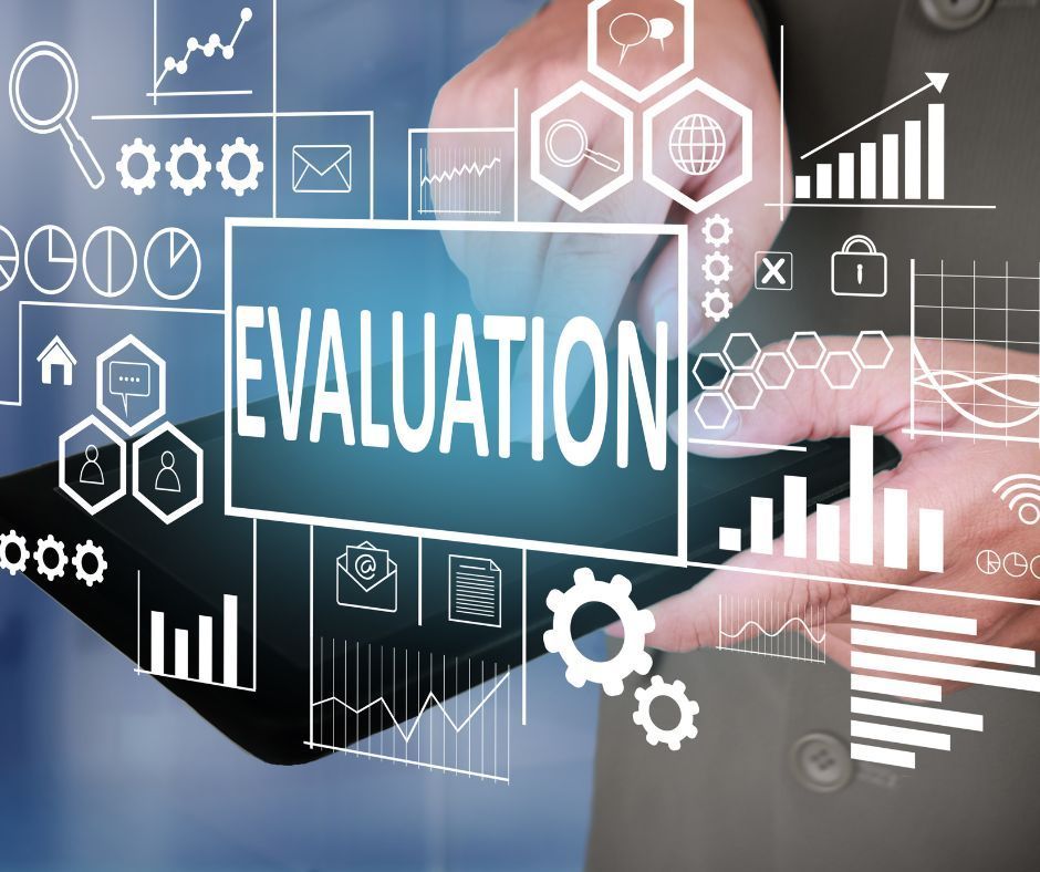 A person is holding a tablet with the word evaluation on it