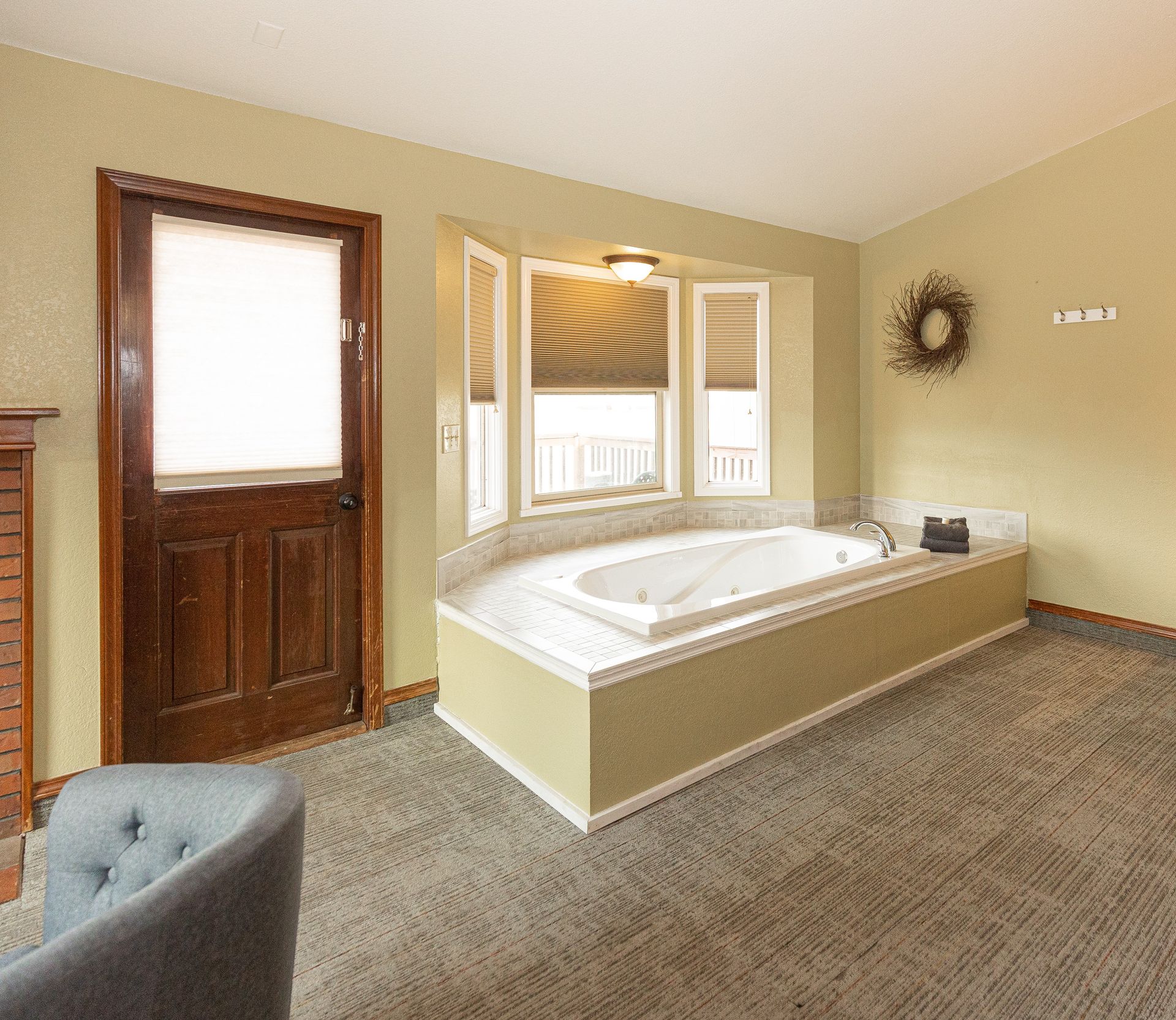 A bathroom with a jacuzzi tub and a fireplace