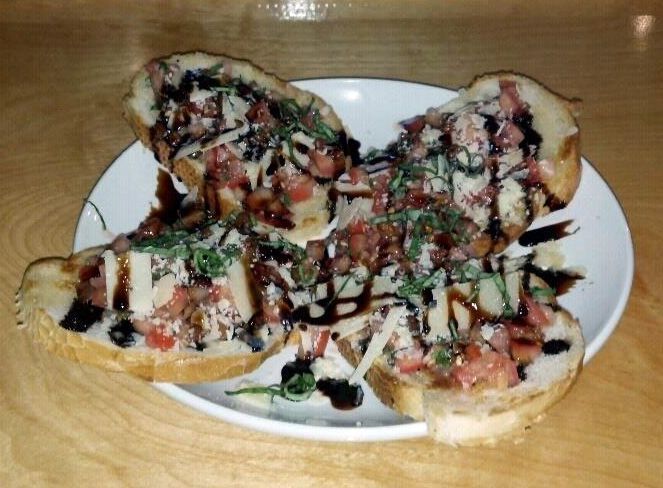 A white plate topped with broccoli and a steak.