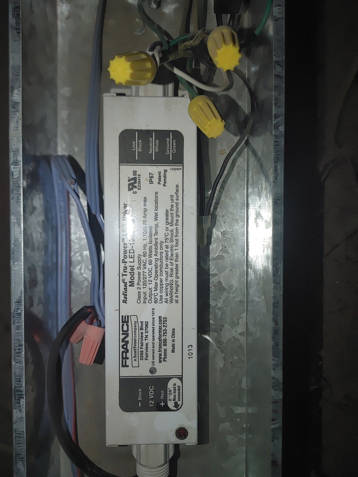 Metal box with electrical components and a FRANDE LED power supply.