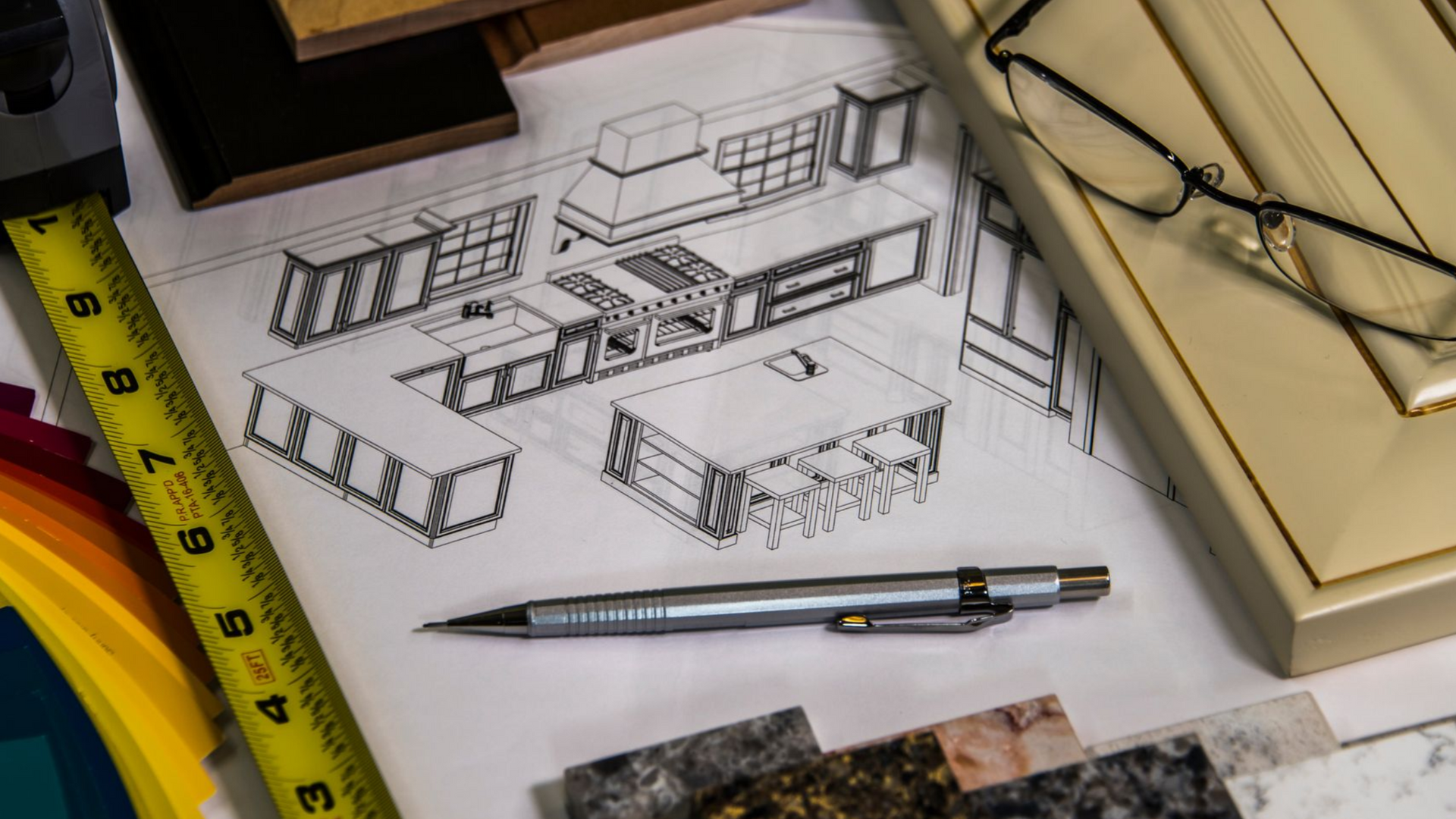 Kitchen design sketch with samples, a pencil, and measuring tape.