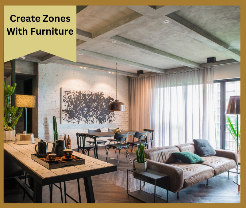 Modern open-concept loft with zoned kitchen, dining, and living areas defined by furniture placement.