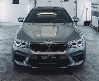 A shiny BMW inside a workshop after undergoing a full service and repair