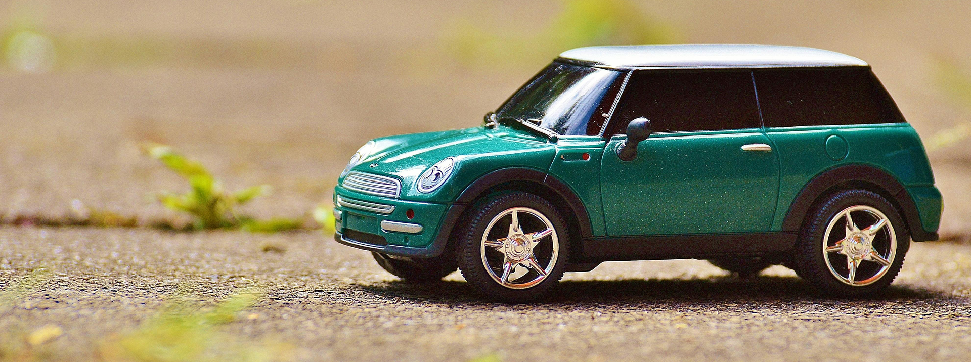 Blue Mini Cooper in the rain.