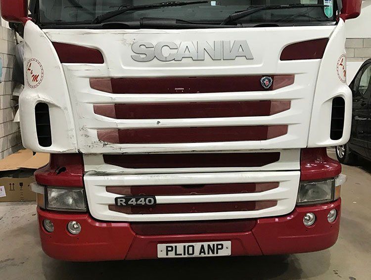 SCANIA HGV with a scuff on the front.