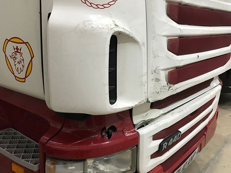 SCANIA HGV with a scuff on the front.