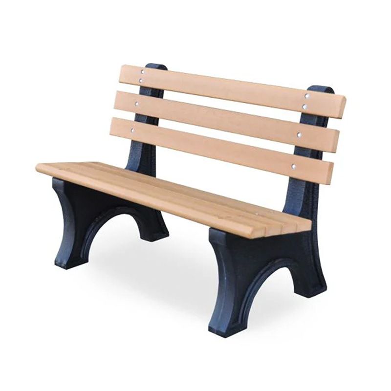 A wooden park bench with black legs on a white background