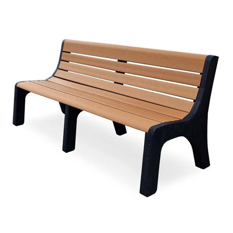 A wooden park bench with black legs on a white background