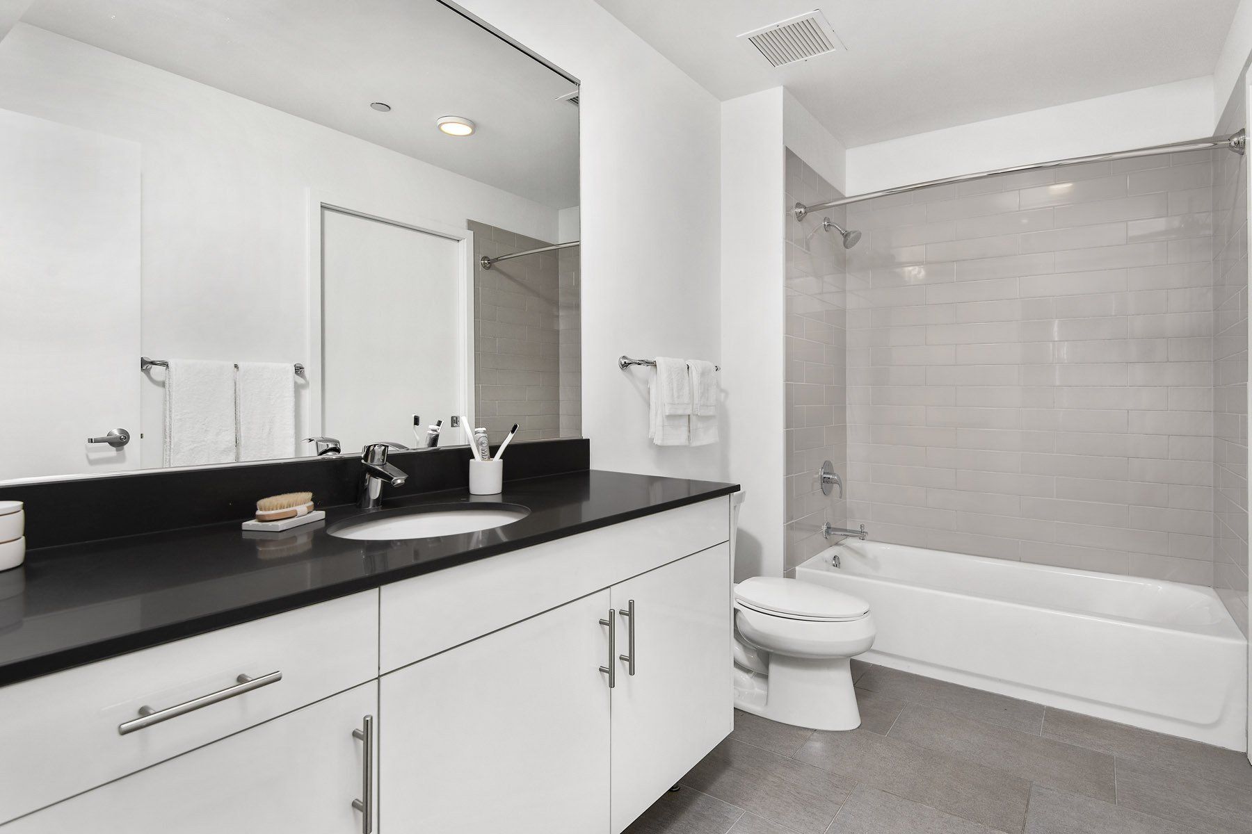 Modern bathroom with tub at Reside on Green Street.