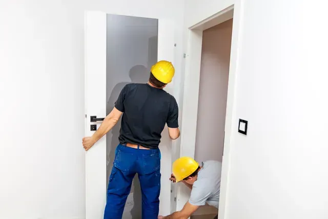 Workers Installing Door — Frankfort, NY — Upstate Home Improvements