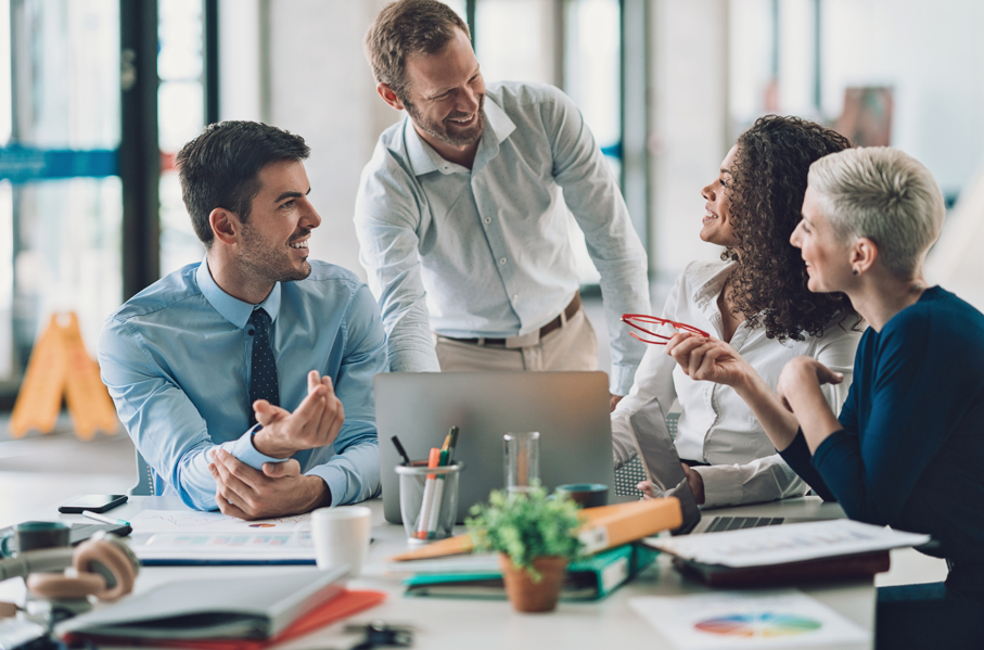 A group of business people are having a meeting in an office.